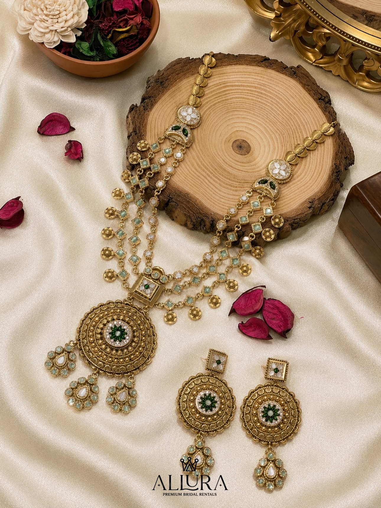 Chand-bali gold bridal set with green stones on marble