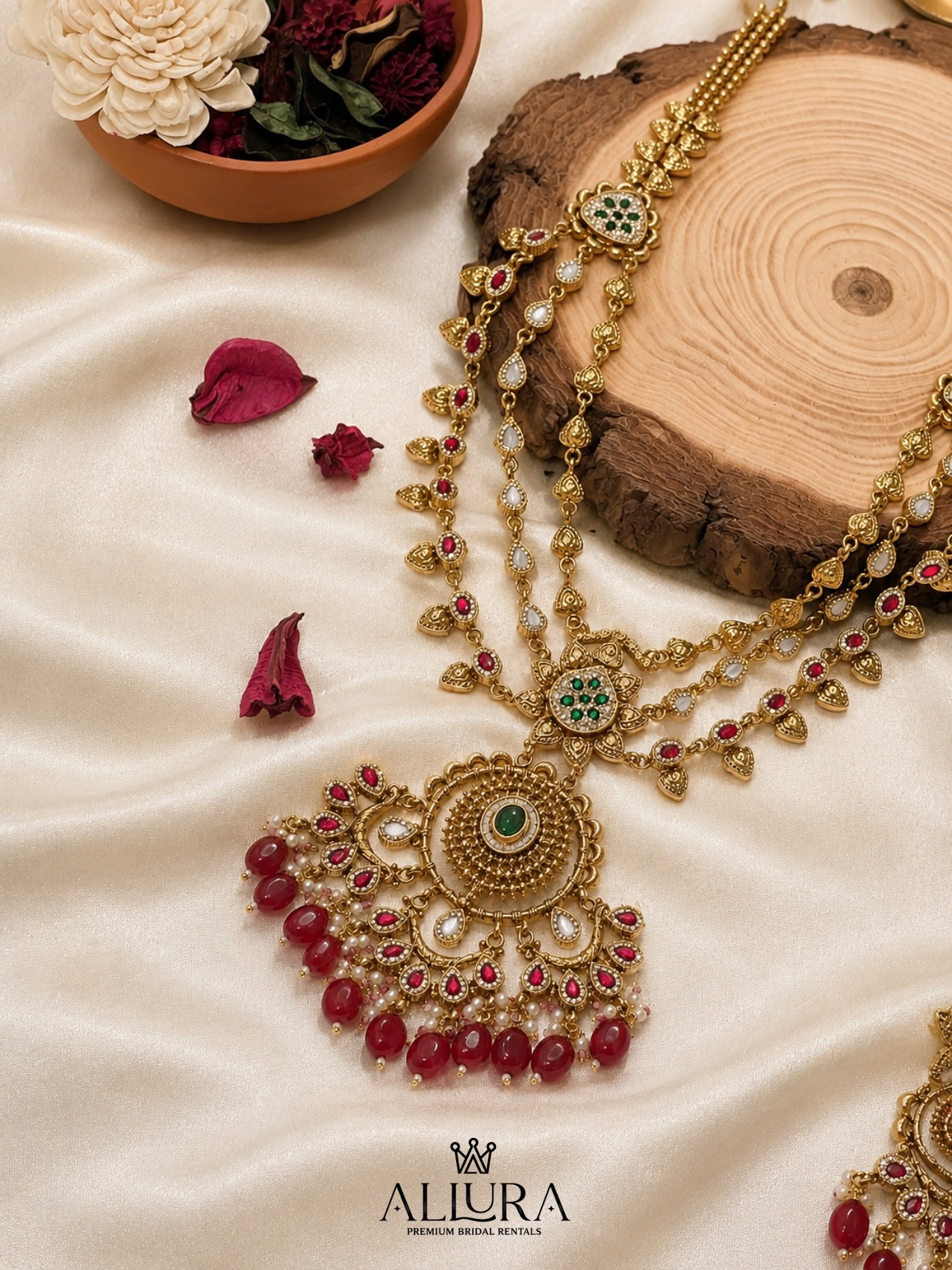 Layered gold haar necklace with red stones