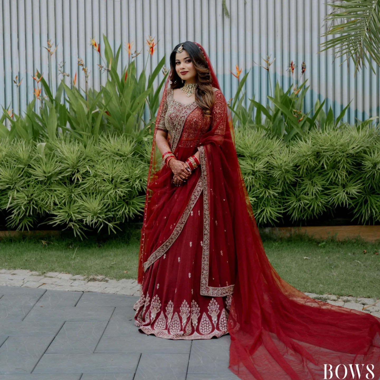 Bride in deep red Kanjivaram silk saree with gold zari border