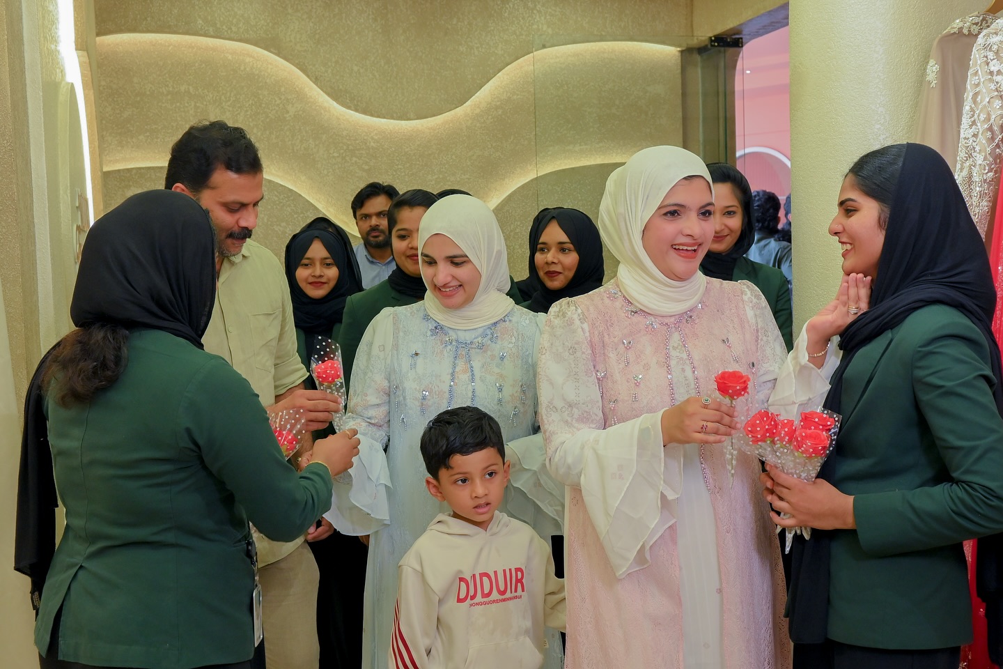 Customers laughing inside the Allura showroom